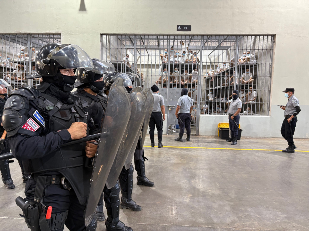 Riot police and prison guards on alert inside the CECOT mega-prison in El Salvador, April 4, 2025. Thomson Reuters Foundation/Nelson Renteria