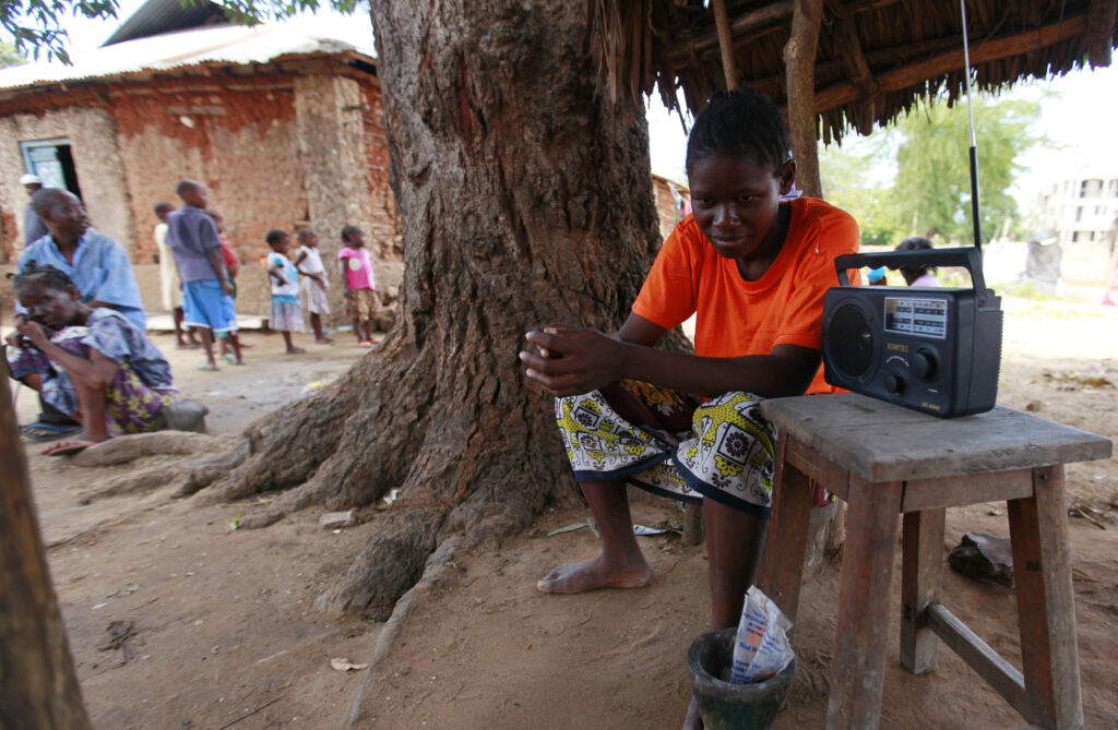 A man listens to a radio to hear news on election results at Mishomoroni area of Kenya's coastal city of Mombasa March 6, 2013. Kenyan authorities were racing to gather final election results on Wednesday after a partial count gave the lead to a politician wanted in The Hague over violence following the previous vote. Counting since Monday's voting has been slow and complicated by hitches in a new electronic system. Politicians have complained about flaws in the process, stirring fears of a repeat of the troubles after the election five years ago.