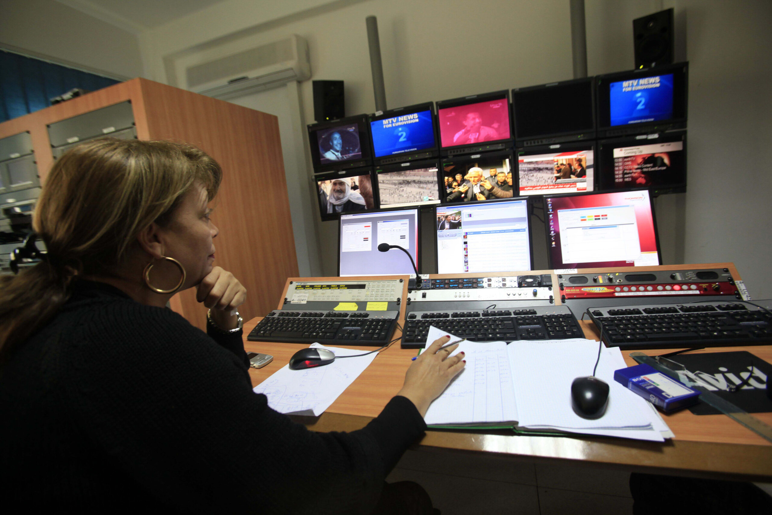 A technician works in the newsroom of Tunisia Television in Tunis February 4, 2011.